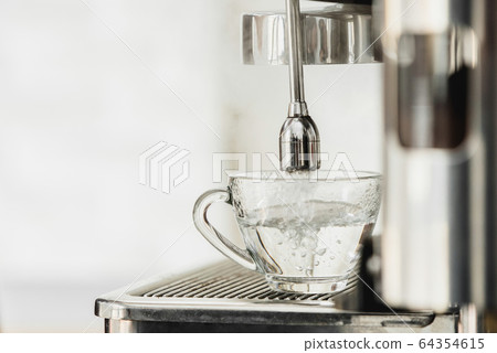 Hot water from coffee maker machine flowing into 64354615