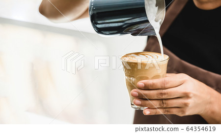 Professional barista making latte art coffee Professional barista making latte art coffee 64354619