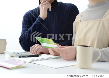 A couple discussing household budget A couple discussing household budget 64354650