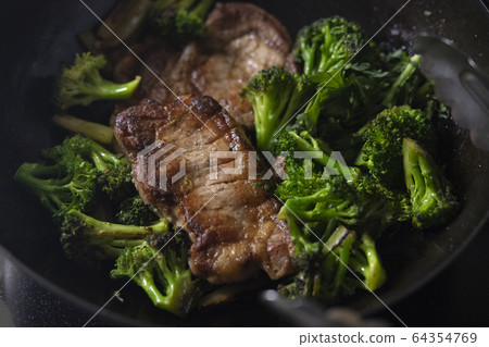 Sautéed pork and broccoli Sautéed pork and broccoli 64354769