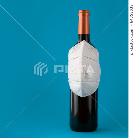 Mask on the bottle as a symbol of protection with copy space Mask on the bottle as a symbol of protection with copy space 64355035