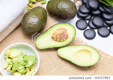 Avocado split in half for skin care and treatment Avocado split in half for skin care and treatment 64357967