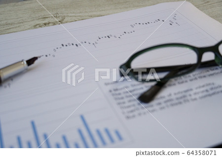 Stock chart and glasses and pen Stock chart and glasses and pen 64358071