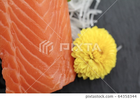 Fresh raw salmon sashimi block and edible chrysanthemum, salmon block for sashimi 64358344