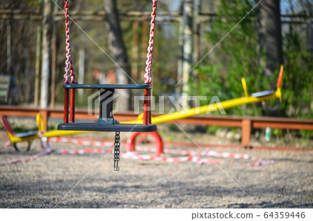 Empty children playground in residential area of Chisinau, Moldova during state of emergency by the reason of covid-19 virus threat 64359446