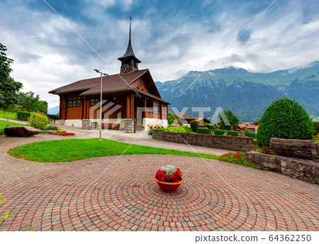 The Swiss village Iseltwald on the famous lake Brienz. The Swiss village Iseltwald on the famous lake Brienz. 64362250