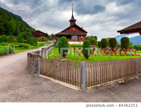The Swiss village Iseltwald on the famous lake Brienz. The Swiss village Iseltwald on the famous lake Brienz. 64362251