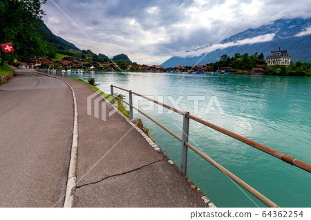 The Swiss village Iseltwald on the famous lake Brienz. The Swiss village Iseltwald on the famous lake Brienz. 64362254
