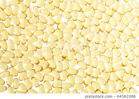 Softgels of Omega-3 on isolated background. Texture of yellow capsules on isolated white background. Medical medicament of polyunsaturated fatty acids. Fish oil capsules, close up. 64362886