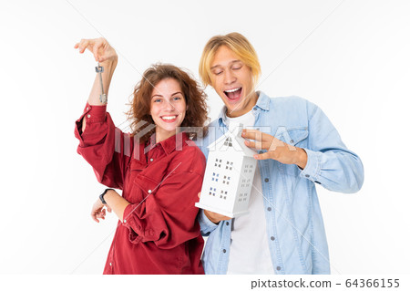 Stylish caucasian blonde man and young woman buy a house isolated on white background Stylish caucasian blonde man and young woman buy a house isolated on white background 64366155