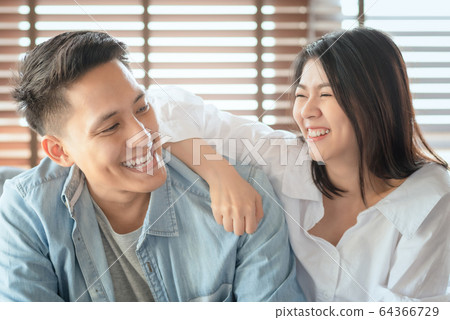 Asian couple lovers enjoy and laugh on vacation Asian couple lovers enjoy and laugh on vacation 64366729