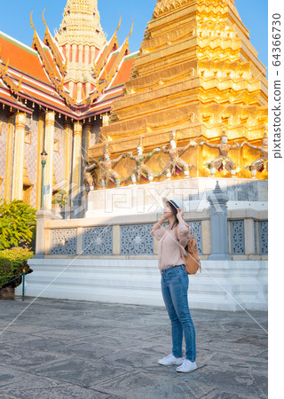 Beautiful asian tourist woman enjoy travel on Vacation in Bangkok at Thailand Beautiful asian tourist woman enjoy travel on Vacation in Bangkok at Thailand 64366730