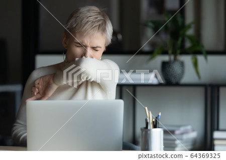 Sick female get infected with coronavirus at workplace Sick female get infected with coronavirus at workplace 64369325