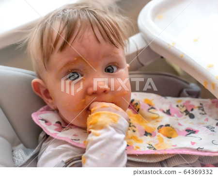 Dirty face of feeding baby Dirty face of feeding baby 64369332