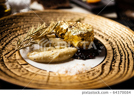 Black Angus tenderloin steak covered with 24 carat gold Black Angus tenderloin steak covered with 24 carat gold 64370084