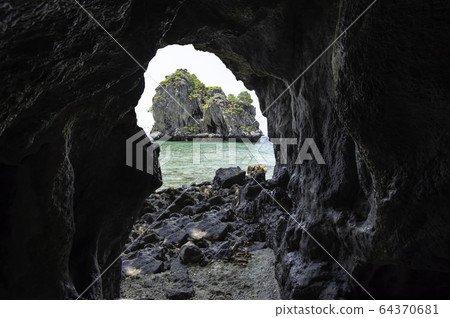 The island is in the sea from a view of the cave at koh Lankajiu , Chumphon , Thailand. 64370681