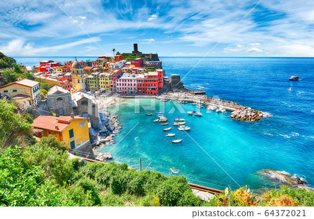 Famous city of Vernazza in Italy during summer Famous city of Vernazza in Italy during summer 64372021