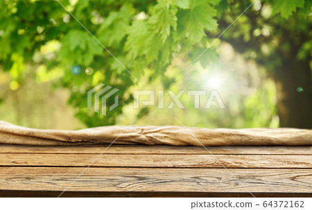 Spring green background wooden table 64372162