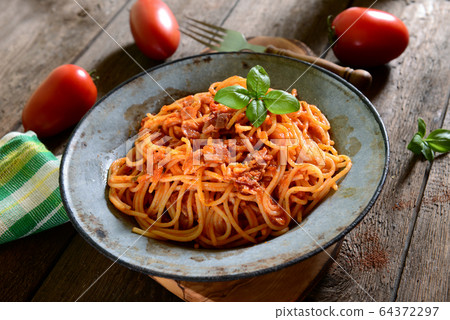 Tasty spaghetti pasta with tomato sauce Tasty spaghetti pasta with tomato sauce 64372297