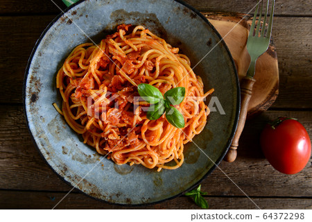 Tasty spaghetti pasta with tomato sauce Tasty spaghetti pasta with tomato sauce 64372298