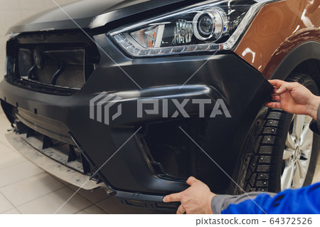 auto mechanic repair car body bumper replacement. 64372526