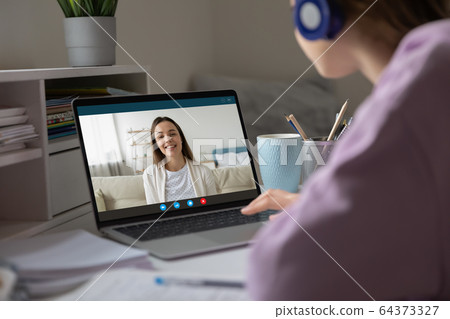 Two girls best friends chatting using virtual modern videoconference application 64373327