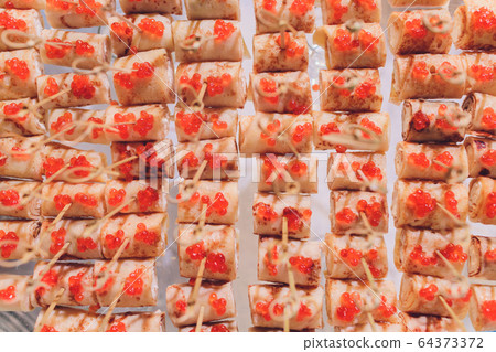Fresh Assorted snacks of canape on the table. Fresh Assorted snacks of canape on the table. 64373372