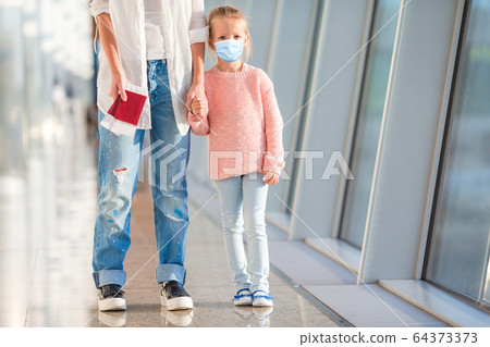 Little kid in airport waiting for boarding Little kid in airport waiting for boarding 64373373