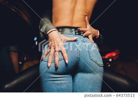 Focus on female and tender female lovers holding hands relaxing. bare back 64373513