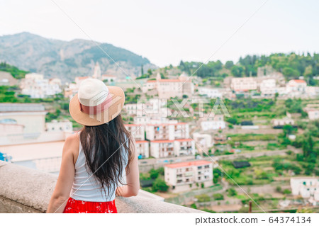 Caucasian tourist walking along the deserted streets of Europe. Caucasian tourist walking along the deserted streets of Europe. 64374134