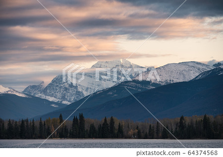 Colorful cloud flowing through rocky mountain on Colorful cloud flowing through rocky mountain on 64374568