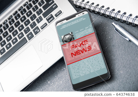 Laptop and smartphone with "fake news" alert Laptop and smartphone with "fake news" alert 64374638