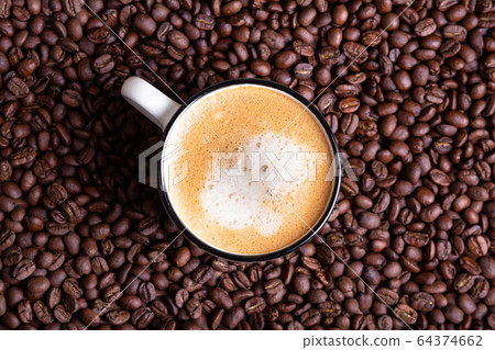 White coffee cup on a solid dark background. White coffee cup on a solid dark background. 64374662