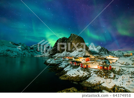 Aurora borealis over Hamnoy in Norway 64374958