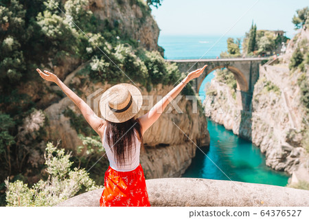 Famous fiordo di furore beach seen from bridge. 64376527