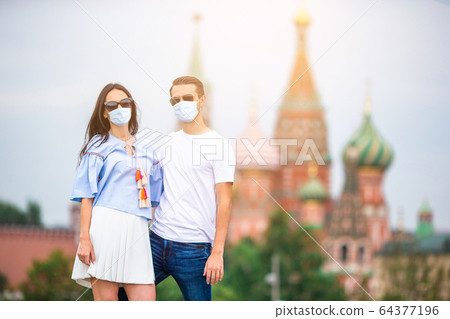 Young dating couple in love walking in city background St Basils Church Young dating couple in love walking in city background St Basils Church 64377196