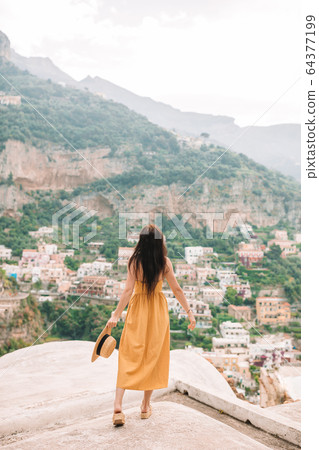 Caucasian tourist walking along the deserted streets of Europe. 64377199