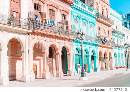 Authentic view of a street of Old Havana with old buildings and cars Authentic view of a street of Old Havana with old buildings and cars 64377240