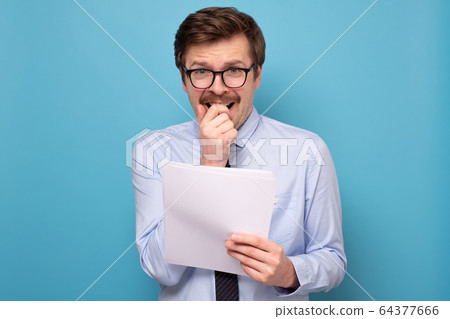 man in funny glasses holding his speech at hands man in funny glasses holding his speech at hands 64377666