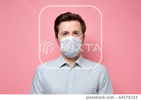 Face verification of caucasian man on pink wall Face verification of caucasian man on pink wall 64378183