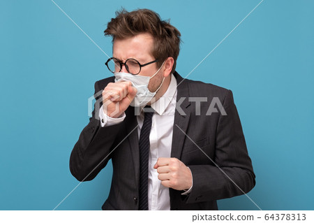 Young caucasian having a terrible dry cough 64378313