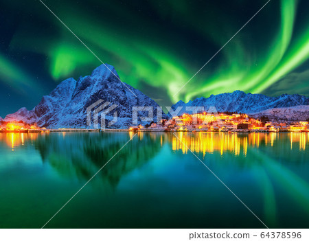 Aurora borealis over winter landscape - lofotens - 64378596