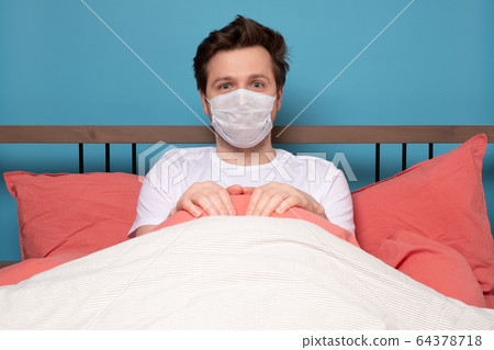 Sick mature caucasian man lying down in bed Sick mature caucasian man lying down in bed 64378718
