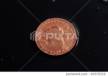 Bitcoin on black background. Bitcoin laundering with water. Bitcoin on black background. Bitcoin laundering with water. 64379318