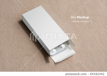 Pillbox mock-up with loafs of tablets inside box 64382442