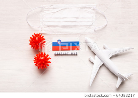 Flight ban and closed borders for tourists and travelers with coronavirus covid-19. Airplane and flag of Slovenia on a white background. Coronavirus pandemic. Flight ban and closed borders for tourists and travelers with coronavirus covid-19. Airplane and flag of Slovenia on a white background. Coronavirus pandemic. 64388217