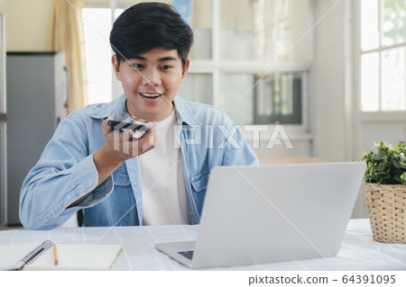 Young man talking with handfree on the phone. Young man talking with handfree on the phone. 64391095