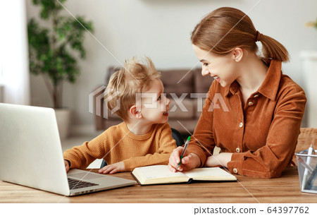 Mother and son working on remote project together. 64397762