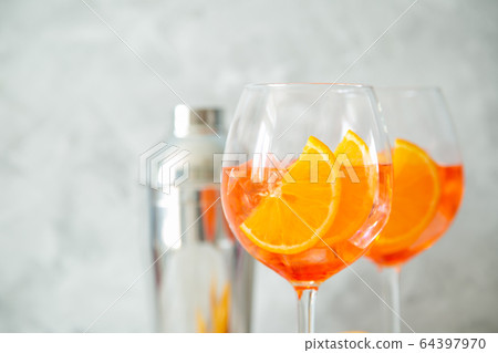 Aperol and ingredients drinks on wood background 64397970
