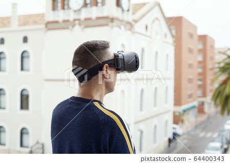 man using a virtual reality headset 64400343